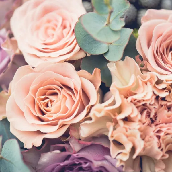Wedding bouquet with pink roses and other flowers
